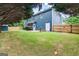 Spacious backyard features lush green grass, a fountain, and a fence, creating a private outdoor space at 1210 Magnolia Park Cir, Cumming, GA 30040