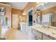The primary bathroom features double sinks, granite countertops, a walk-in shower, and a soaking tub at 1210 Magnolia Park Cir, Cumming, GA 30040
