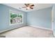 Bedroom with light blue walls and a large window at 1210 Magnolia Park Cir, Cumming, GA 30040