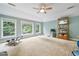 Spacious bonus room with neutral carpet and lots of natural light at 1210 Magnolia Park Cir, Cumming, GA 30040