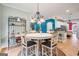 Cozy dining room with stylish chandelier lighting and views into the living space at 1210 Magnolia Park Cir, Cumming, GA 30040