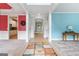 Inviting foyer with colorful accent walls, decorative columns, and view into the kitchen at 1210 Magnolia Park Cir, Cumming, GA 30040