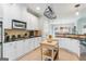 Beautiful kitchen featuring white cabinets, a kitchen island with butcher block, and stainless steel appliances at 1210 Magnolia Park Cir, Cumming, GA 30040