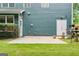 Enjoy the large concrete patio and mature landscaping enhancing the home's outdoor appeal at 1210 Magnolia Park Cir, Cumming, GA 30040