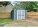 View of the backyard shed and the privacy fence, enhancing the functionality and appeal of the property at 1210 Magnolia Park Cir, Cumming, GA 30040