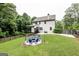 Spacious backyard features a patio with outdoor seating, a well-maintained lawn, and a classic wood fence at 101 High Bluff Trl, Carrollton, GA 30116