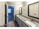 Bathroom featuring double vanity sinks with large mirrors, granite countertops at 101 High Bluff Trl, Carrollton, GA 30116