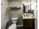Compact powder room featuring updated vanity, mirror, and modern fixtures at 101 High Bluff Trl, Carrollton, GA 30116