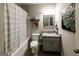 Well-lit bathroom with tub/shower combo, granite countertop vanity, and decorative wall art at 101 High Bluff Trl, Carrollton, GA 30116