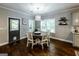 Bright dining room with hardwood floors, modern lighting fixture, and lots of natural light at 101 High Bluff Trl, Carrollton, GA 30116