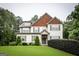 Inviting two-story home with a manicured lawn, complemented by lush greenery, offering a picturesque curb appeal at 101 High Bluff Trl, Carrollton, GA 30116