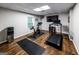 Bright home gym featuring a treadmill, stationary bike, and motivational decor at 101 High Bluff Trl, Carrollton, GA 30116