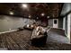 This home theater is perfect for movie nights, with comfortable seating and stylish decor at 101 High Bluff Trl, Carrollton, GA 30116