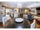 Open living space with fireplace, kitchen with island, and a large dining table at 101 High Bluff Trl, Carrollton, GA 30116