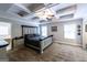 Spacious main bedroom features tray ceilings, fan, and light neutral paint at 101 High Bluff Trl, Carrollton, GA 30116