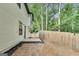 Exterior backyard with cement patio, perfect for outdoor activities and gardening at 131 Turning Pt, Stockbridge, GA 30281