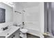 Bathroom featuring modern fixtures, a shower/bathtub, a toilet, a sink, and a mirror at 131 Turning Pt, Stockbridge, GA 30281
