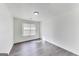 Bright bedroom features a window allowing ample light and wood-look floors at 131 Turning Pt, Stockbridge, GA 30281