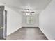 Bright bedroom features a ceiling fan, a window for natural light, and wood-look flooring at 131 Turning Pt, Stockbridge, GA 30281