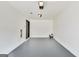 Clean, empty garage with painted floors, offering ample storage and parking space at 131 Turning Pt, Stockbridge, GA 30281