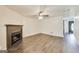 Cozy living room featuring a fireplace, modern flooring, and ample natural light, perfect for relaxation at 131 Turning Pt, Stockbridge, GA 30281