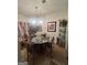 Cozy dining room with a glass table, chandelier, and decorative accents for elegant dining at 2208 Crossrail Dr, Atlanta, GA 30349