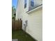 The house features a vinyl siding exterior and a wooden fence enclosing the yard at 2208 Crossrail Dr, Atlanta, GA 30349