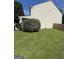 The house has a large, well-kept lawn along the side, complemented by green shrubs at 2208 Crossrail Dr, Atlanta, GA 30349