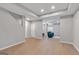 Finished basement area with modern flooring, recessed lighting, and comfortable seating at 3400 Dencrest Se Ct, Smyrna, GA 30080