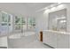 A luxurious bathroom with a standalone tub and elegant vanity offers a spa-like experience at 3400 Dencrest Se Ct, Smyrna, GA 30080