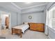 Comfortable bedroom featuring a twin bed and wooden dresser at 3400 Dencrest Se Ct, Smyrna, GA 30080