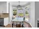 Cozy breakfast nook with a view of the backyard, adjacent to the kitchen, perfect for casual meals at 3400 Dencrest Se Ct, Smyrna, GA 30080