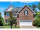 Charming brick two-story home with well-manicured lawn and attached two-car garage in a desirable neighborhood at 3400 Dencrest Se Ct, Smyrna, GA 30080