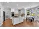 Spacious kitchen with white cabinets, granite countertops, stainless steel appliances, and a center island at 3400 Dencrest Se Ct, Smyrna, GA 30080