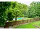 Beautiful pool view overlooking a backyard with gazebo and privacy fence at 150 Sandy Ridge Trl, Fayetteville, GA 30214