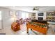 Basement game room and play area featuring a fireplace, foosball table, and doll houses at 150 Sandy Ridge Trl, Fayetteville, GA 30214