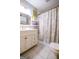 Bathroom featuring a white vanity, tile flooring, and a shower with a patterned curtain at 150 Sandy Ridge Trl, Fayetteville, GA 30214