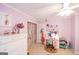 Charming bedroom with white furniture, light purple walls, and bright lighting at 150 Sandy Ridge Trl, Fayetteville, GA 30214