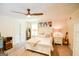 Bright bedroom features neutral decor, ensuite access, and ample natural light at 150 Sandy Ridge Trl, Fayetteville, GA 30214