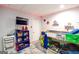 Playful bedroom with a bunk bed, storage shelves, and a wall-mounted TV at 150 Sandy Ridge Trl, Fayetteville, GA 30214