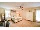 Cozy main bedroom with natural light, neutral colors, and ensuite access at 150 Sandy Ridge Trl, Fayetteville, GA 30214