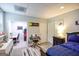 Neat bedroom with a study area, storage units, and a comfortable bed at 150 Sandy Ridge Trl, Fayetteville, GA 30214