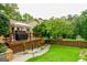 Wooden deck with a grill, patio furniture, and access to the backyard, great for outdoor gatherings at 150 Sandy Ridge Trl, Fayetteville, GA 30214