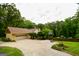 Spacious home featuring an attached two-car garage, basketball hoop and a large driveway at 150 Sandy Ridge Trl, Fayetteville, GA 30214