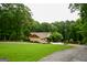 Charming single Gathering home with attached garage, long drive and ample green space at 150 Sandy Ridge Trl, Fayetteville, GA 30214