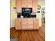 Kitchen coffee bar with custom cabinets and hardwood floors at 150 Sandy Ridge Trl, Fayetteville, GA 30214