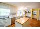 Bright kitchen featuring custom cabinetry, stainless steel appliances, and a large island at 150 Sandy Ridge Trl, Fayetteville, GA 30214