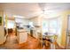 Bright eat-in kitchen with stainless steel appliances, white cabinets, and breakfast nook at 150 Sandy Ridge Trl, Fayetteville, GA 30214