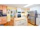 Modern kitchen featuring stainless steel appliances and an island at 150 Sandy Ridge Trl, Fayetteville, GA 30214