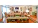 Open-concept living room with comfortable seating, fireplace, and hardwood floors at 150 Sandy Ridge Trl, Fayetteville, GA 30214